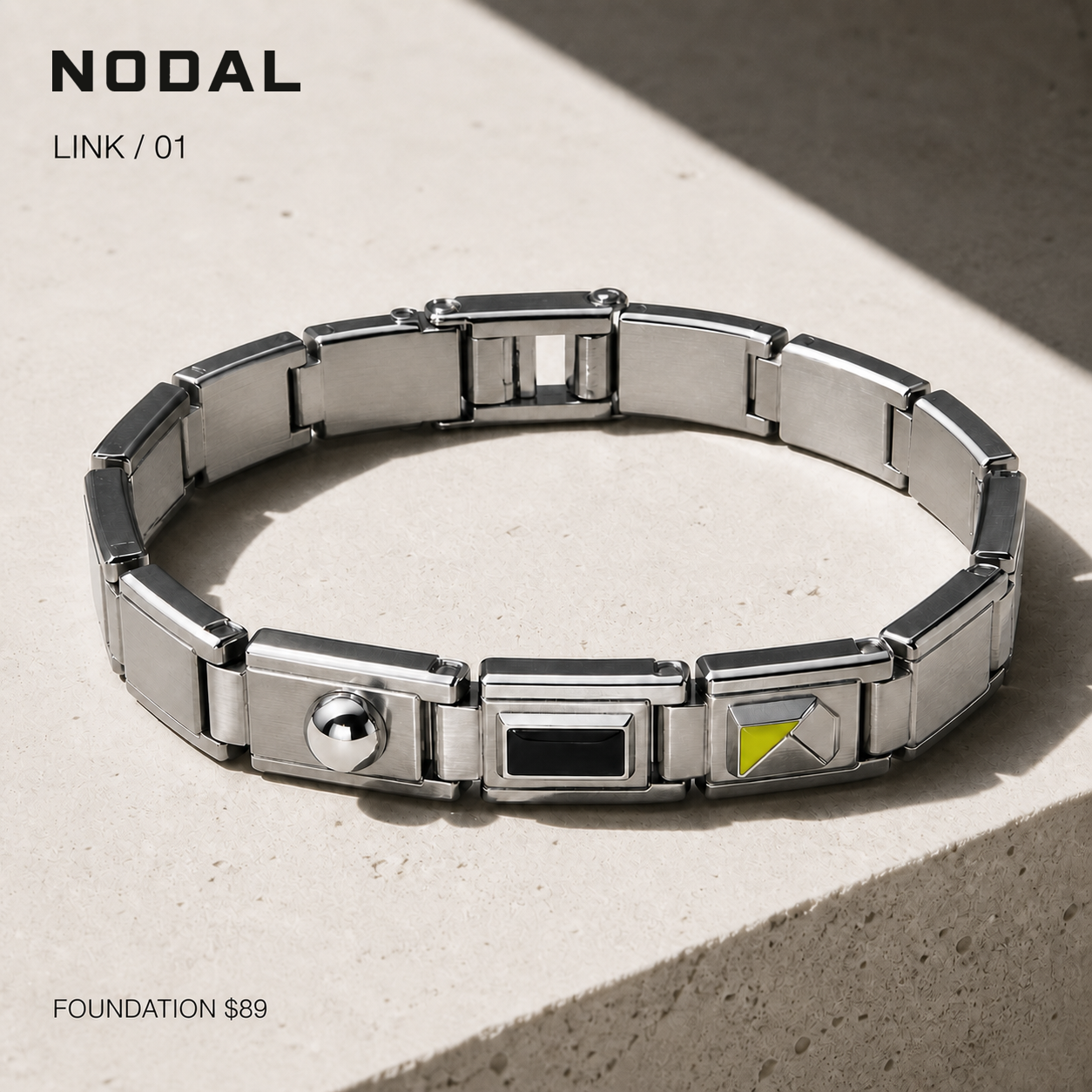 LINK / 01 articulated stainless-steel bracelet on limestone
